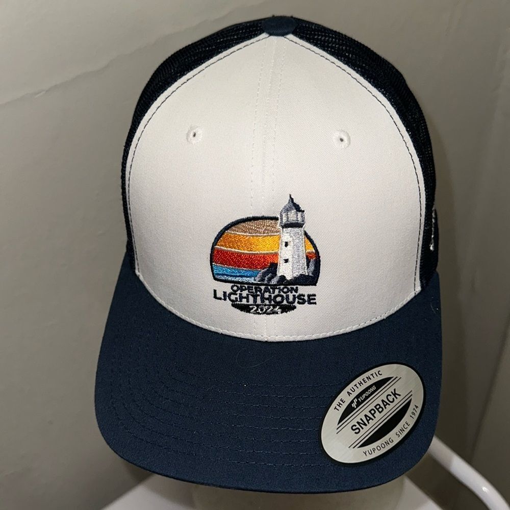NWT Yupoong navy blue & white snapback trucker hat with Lighthouse embroidery
